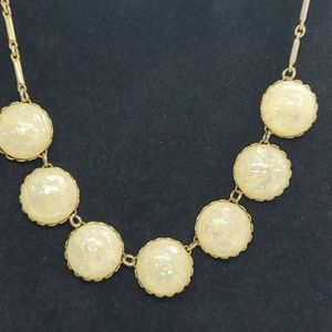 Yellow glittery half disc long link gold tone neck